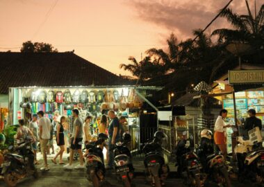 https://unsplash.com/photos/a-group-of-people-stand-outside-a-shop-cwZxZ2rCrs0?utm_source=unsplash&utm_medium=referral&utm_content=creditShareLink